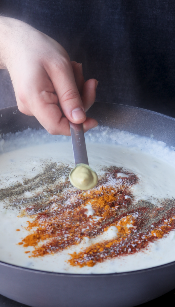 Saute onions and jalapeños in butter and garlic then add flour, whole milk, half and half cream, a perfect blend of seasonings, dijon mustard
